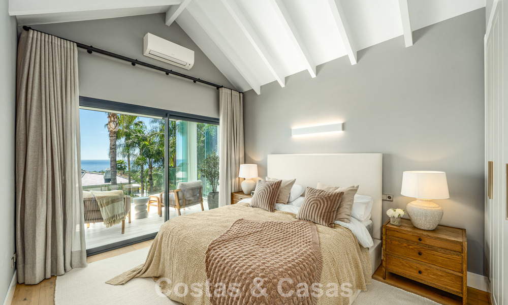 Refined luxury villa in modern Mediterranean style for sale with sea views in a gated complex on Marbella's Golden Mile 778769