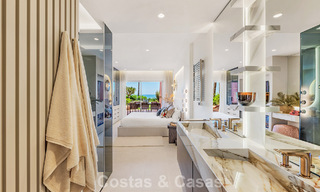 High quality renovated garden apartment with open sea views for sale, frontline beach between Marbella and Estepona 783422 