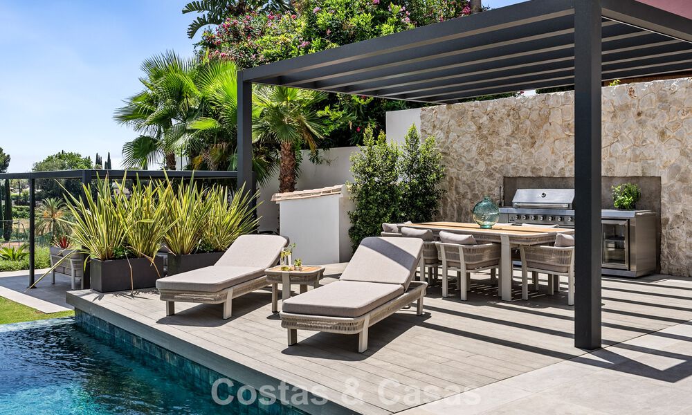 Frontline golf villa with golf and sea views for sale in the prestigious 5* golf resort in Marbella - Benahavis 783386