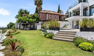 Frontline golf villa with golf and sea views for sale in the prestigious 5* golf resort in Marbella - Benahavis 783387 