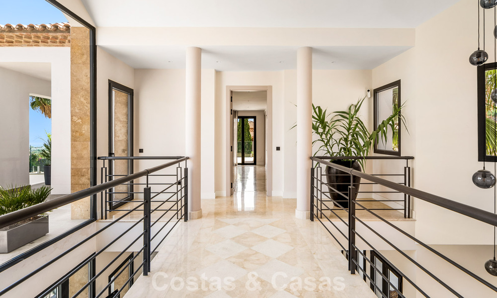 Frontline golf villa with golf and sea views for sale in the prestigious 5* golf resort in Marbella - Benahavis 783396