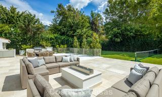 Impressive luxury villa with grass tennis court for sale close to all amenities on Marbella's renowned Golden Mile 782702 