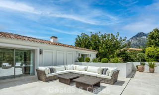 Impressive luxury villa with grass tennis court for sale close to all amenities on Marbella's renowned Golden Mile 782711 