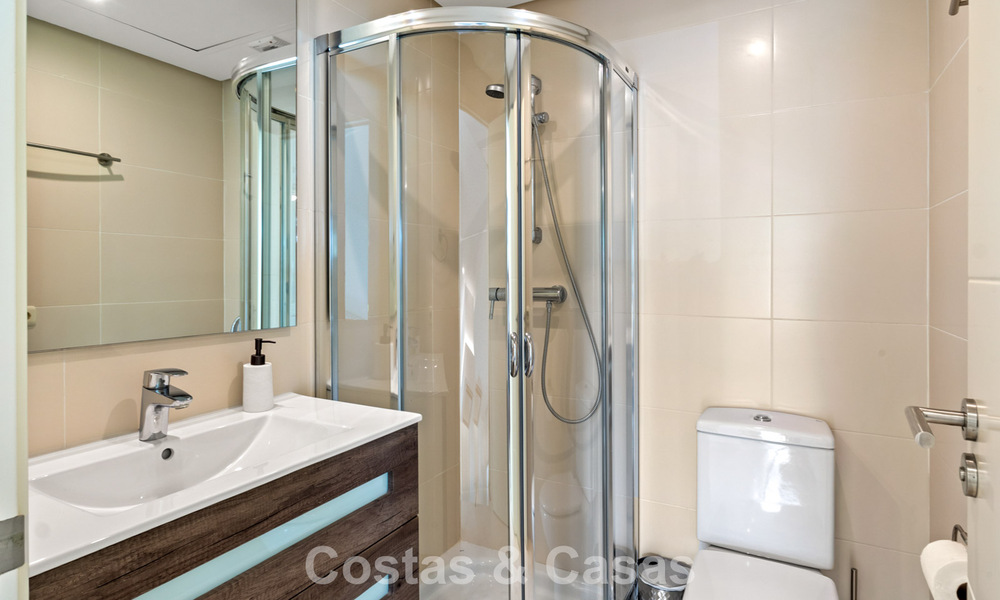 Move-in ready, 2-bedroom garden apartment for sale in an exclusive complex near a large blue lagoon on the Costa del Sol 783968