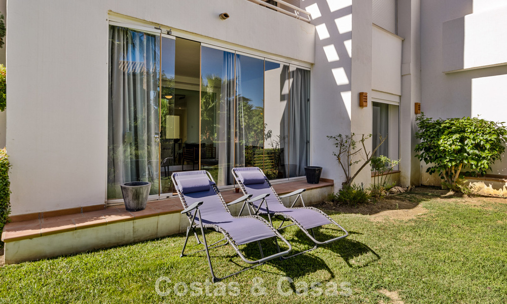 Move-in ready, 2-bedroom garden apartment for sale in an exclusive complex near a large blue lagoon on the Costa del Sol 783974