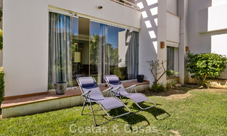 Move-in ready, 2-bedroom garden apartment for sale in an exclusive complex near a large blue lagoon on the Costa del Sol 783974 