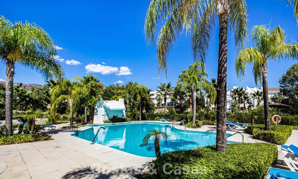 Move-in ready, 2-bedroom garden apartment for sale in an exclusive complex near a large blue lagoon on the Costa del Sol 783977