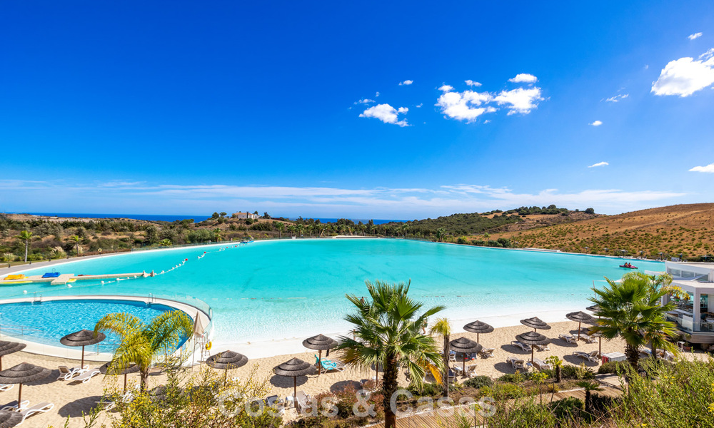 Move-in ready, 2-bedroom garden apartment for sale in an exclusive complex near a large blue lagoon on the Costa del Sol 783978