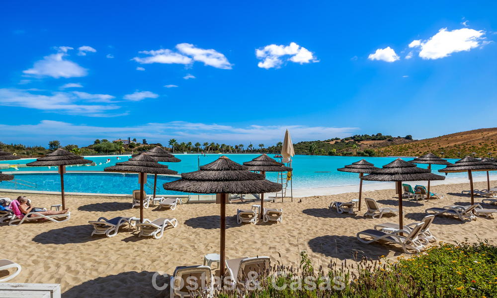 Move-in ready, 2-bedroom garden apartment for sale in an exclusive complex near a large blue lagoon on the Costa del Sol 783980