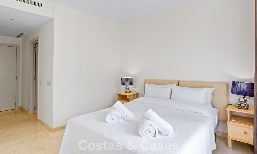 Move-in ready, 2-bedroom garden apartment for sale in an exclusive complex near a large blue lagoon on the Costa del Sol 783984
