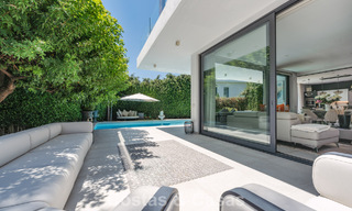 Modernist villa for sale in a private community surrounded by greenery, on the New Golden Mile between Marbella and Estepona 785370 
