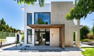 Modernist villa for sale in a private community surrounded by greenery, on the New Golden Mile between Marbella and Estepona 785372 