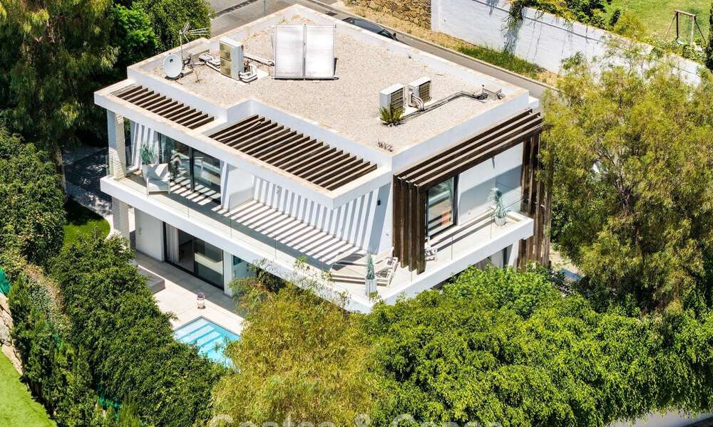 Modernist villa for sale in a private community surrounded by greenery, on the New Golden Mile between Marbella and Estepona 785376