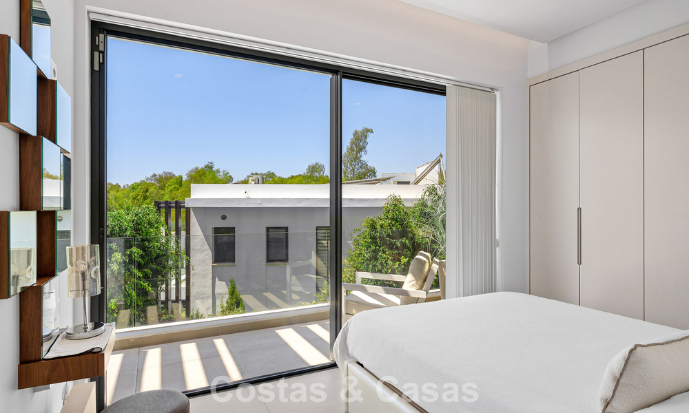 Modernist villa for sale in a private community surrounded by greenery, on the New Golden Mile between Marbella and Estepona 785377
