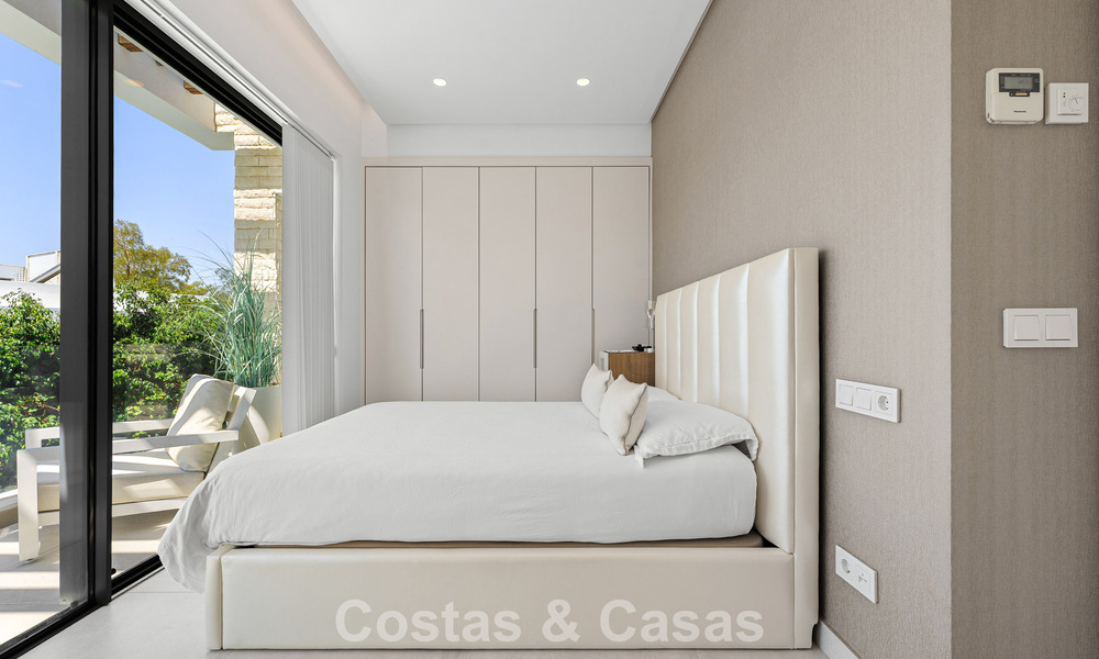 Modernist villa for sale in a private community surrounded by greenery, on the New Golden Mile between Marbella and Estepona 785378
