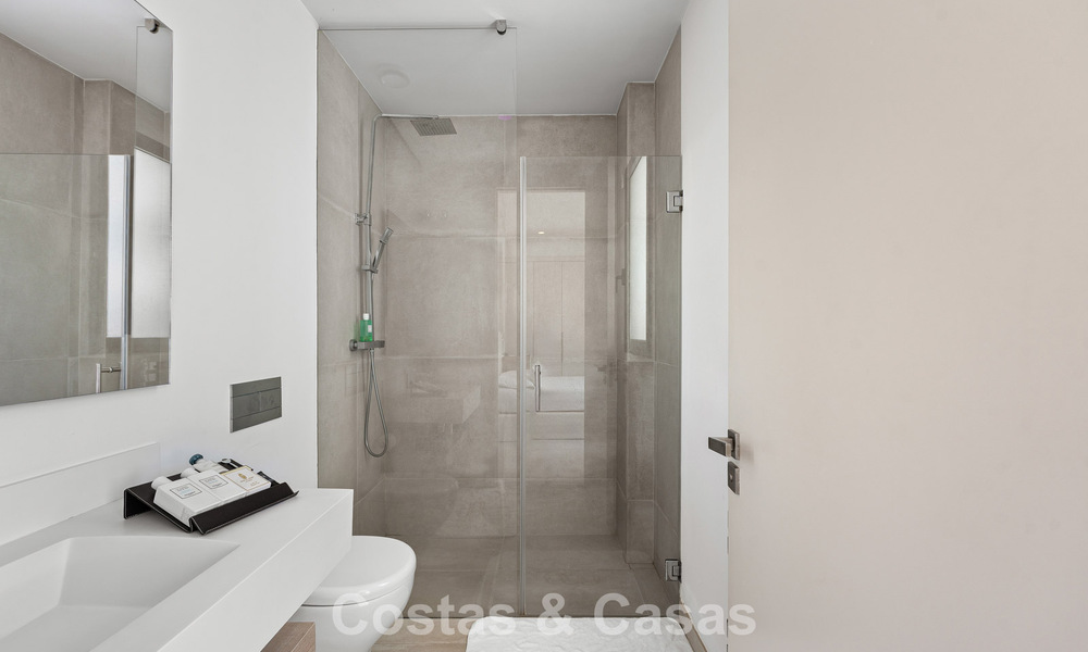 Modernist villa for sale in a private community surrounded by greenery, on the New Golden Mile between Marbella and Estepona 785379