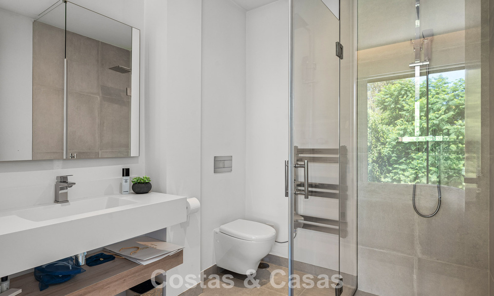 Modernist villa for sale in a private community surrounded by greenery, on the New Golden Mile between Marbella and Estepona 785381