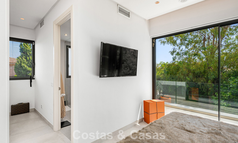 Modernist villa for sale in a private community surrounded by greenery, on the New Golden Mile between Marbella and Estepona 785383