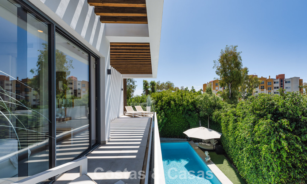 Modernist villa for sale in a private community surrounded by greenery, on the New Golden Mile between Marbella and Estepona 785385