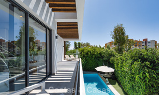Modernist villa for sale in a private community surrounded by greenery, on the New Golden Mile between Marbella and Estepona 785385 