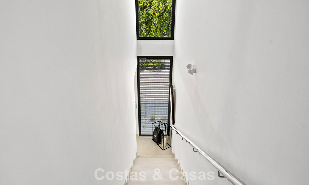 Modernist villa for sale in a private community surrounded by greenery, on the New Golden Mile between Marbella and Estepona 785386