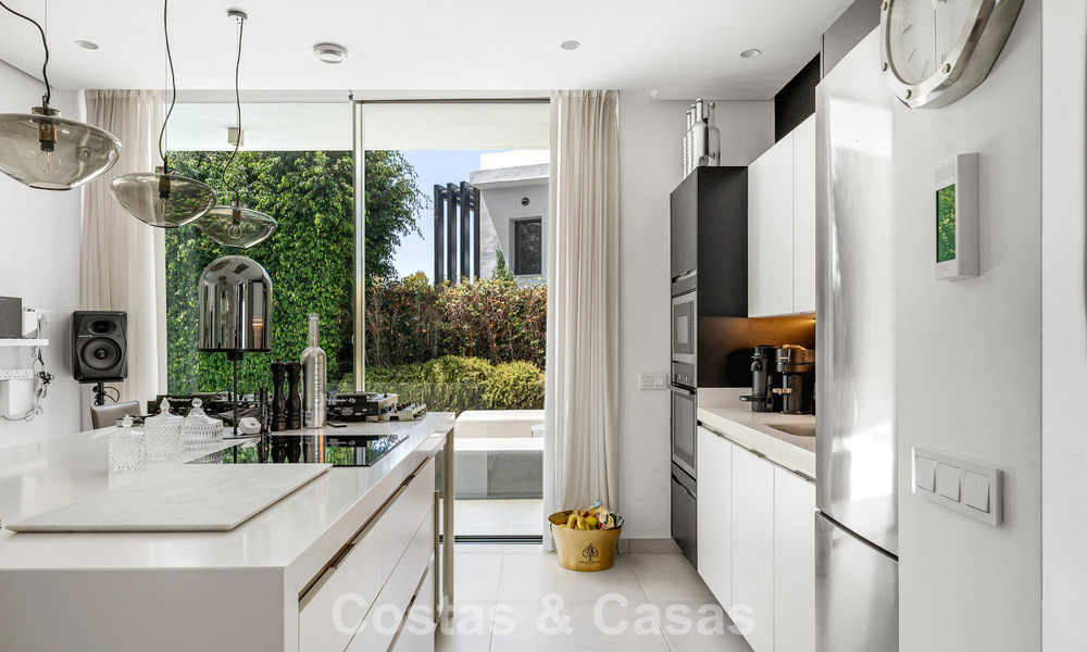 Modernist villa for sale in a private community surrounded by greenery, on the New Golden Mile between Marbella and Estepona 785390