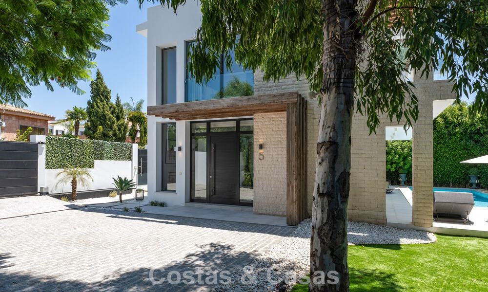 Modernist villa for sale in a private community surrounded by greenery, on the New Golden Mile between Marbella and Estepona 785397