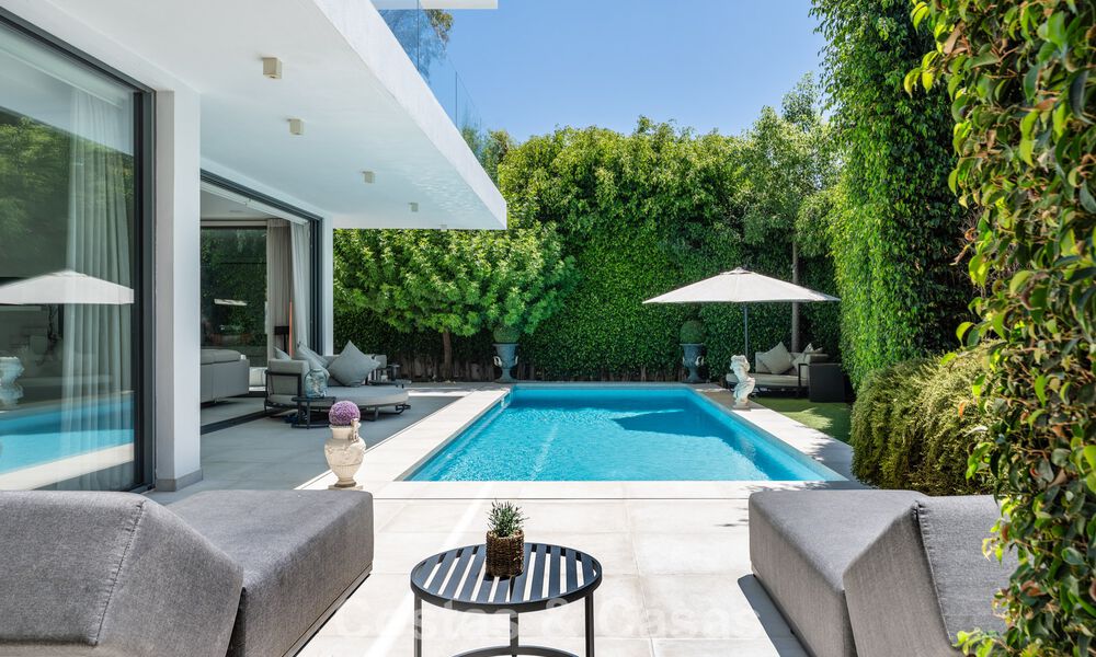 Modernist villa for sale in a private community surrounded by greenery, on the New Golden Mile between Marbella and Estepona 785399