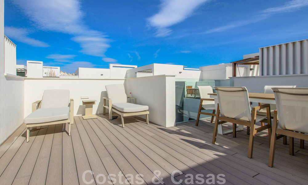 Move-in ready, modernist terraced house with frontal sea views for sale just a few minutes' walk from Estepona town center 786312