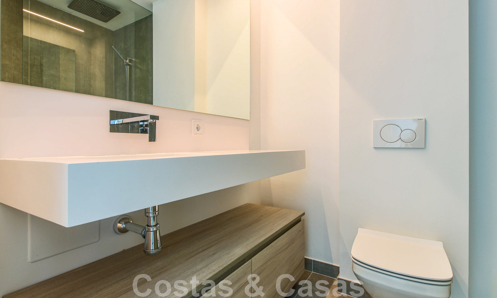 Move-in ready, modernist terraced house with frontal sea views for sale just a few minutes' walk from Estepona town center 786314