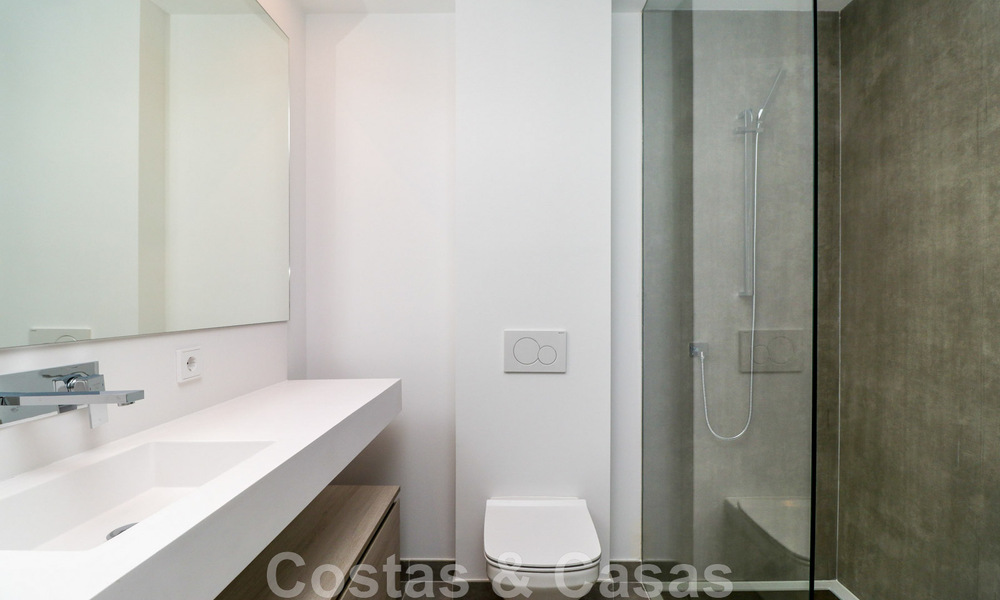 Move-in ready, modernist terraced house with frontal sea views for sale just a few minutes' walk from Estepona town center 786333