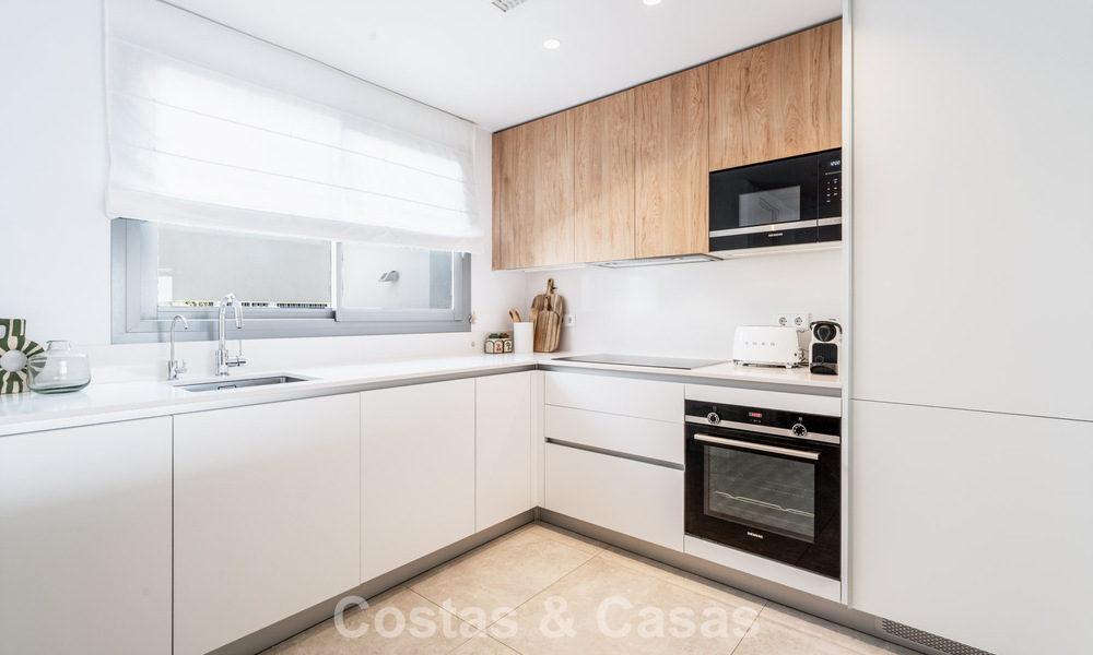 Move-in ready, modern, spacious 4-bedroom apartment for sale with a large private garden in a luxury resort east of Marbella center 787085