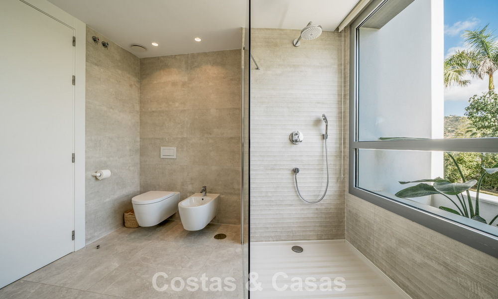 Move-in ready, modern, spacious 4-bedroom apartment for sale with a large private garden in a luxury resort east of Marbella center 787107