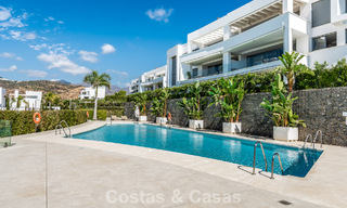 Move-in ready, modern, spacious 4-bedroom apartment for sale with a large private garden in a luxury resort east of Marbella center 787112 