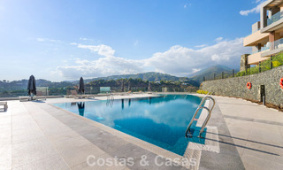 Move-in ready apartment with modern architecture for sale in a golf resort in the hills of Marbella - Benahavis 787141 