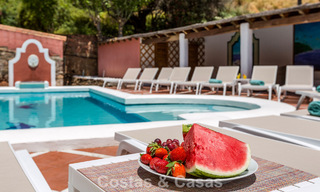 Stately luxury villa for sale in a classic Andalusian style in a gated, prestigious urbanization in Benahavis - Marbella 787974 