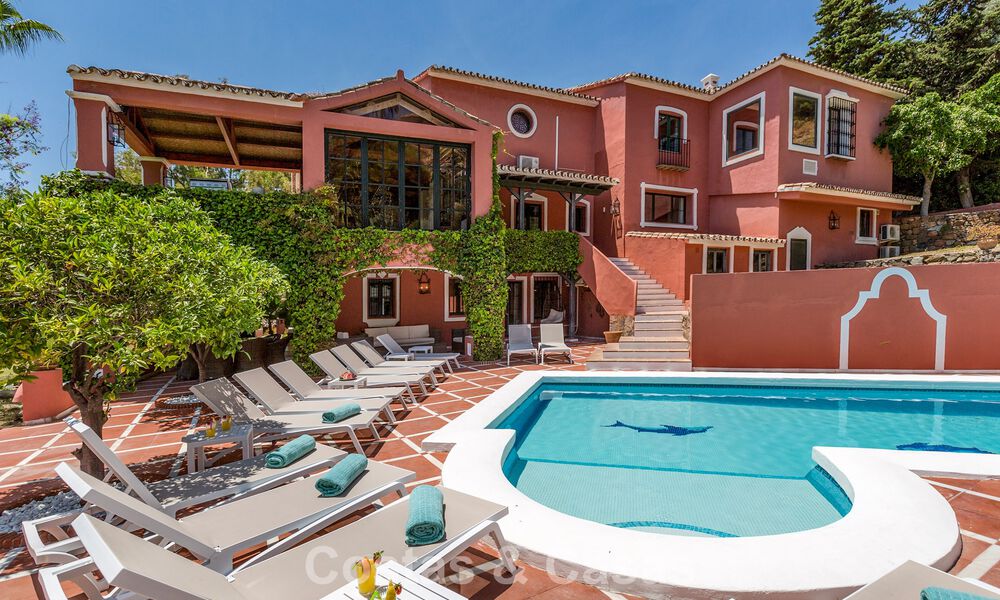 Stately luxury villa for sale in a classic Andalusian style in a gated, prestigious urbanization in Benahavis - Marbella 787976