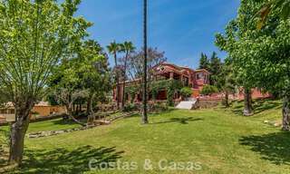 Stately luxury villa for sale in a classic Andalusian style in a gated, prestigious urbanization in Benahavis - Marbella 787979 