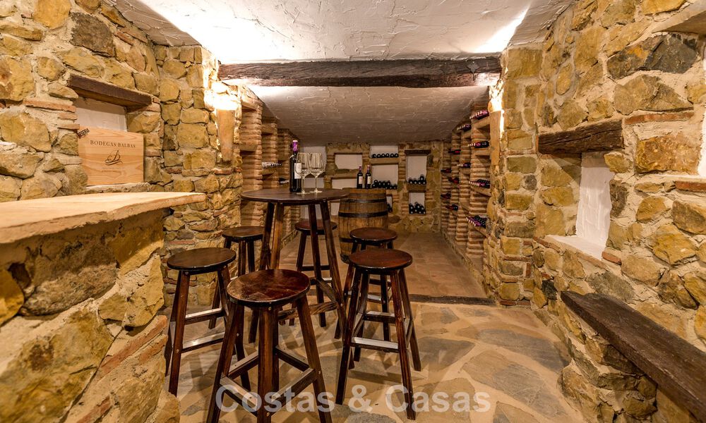 Stately luxury villa for sale in a classic Andalusian style in a gated, prestigious urbanization in Benahavis - Marbella 787985