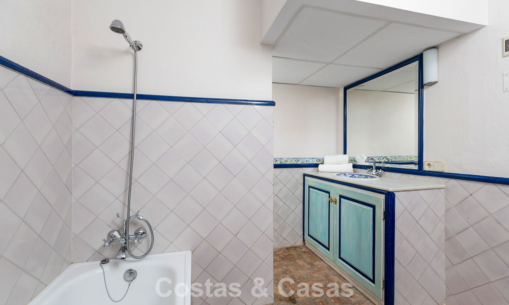 Stately luxury villa for sale in a classic Andalusian style in a gated, prestigious urbanization in Benahavis - Marbella 787988