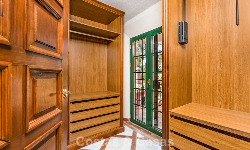 Stately luxury villa for sale in a classic Andalusian style in a gated, prestigious urbanization in Benahavis - Marbella 787989