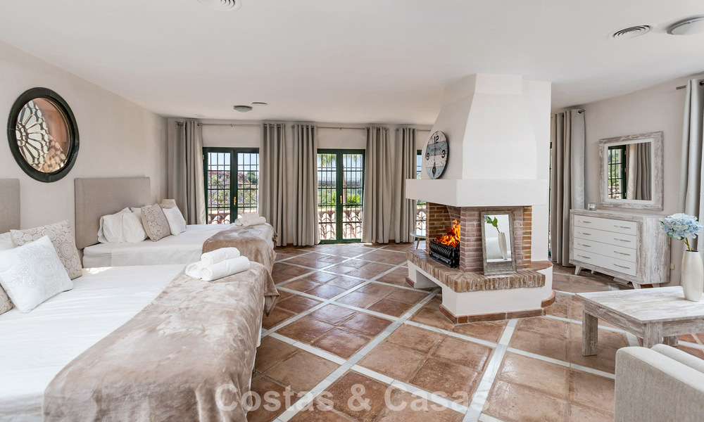 Stately luxury villa for sale in a classic Andalusian style in a gated, prestigious urbanization in Benahavis - Marbella 787991