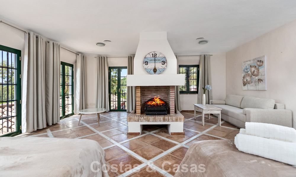 Stately luxury villa for sale in a classic Andalusian style in a gated, prestigious urbanization in Benahavis - Marbella 787992