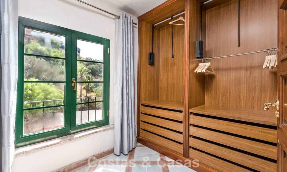 Stately luxury villa for sale in a classic Andalusian style in a gated, prestigious urbanization in Benahavis - Marbella 787994