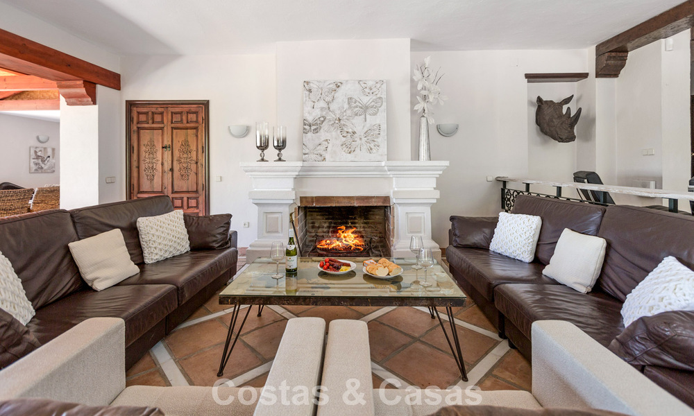 Stately luxury villa for sale in a classic Andalusian style in a gated, prestigious urbanization in Benahavis - Marbella 787995