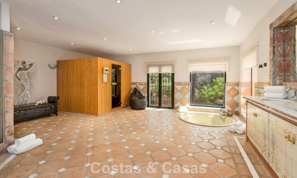 Stately luxury villa for sale in a classic Andalusian style in a gated, prestigious urbanization in Benahavis - Marbella 787996