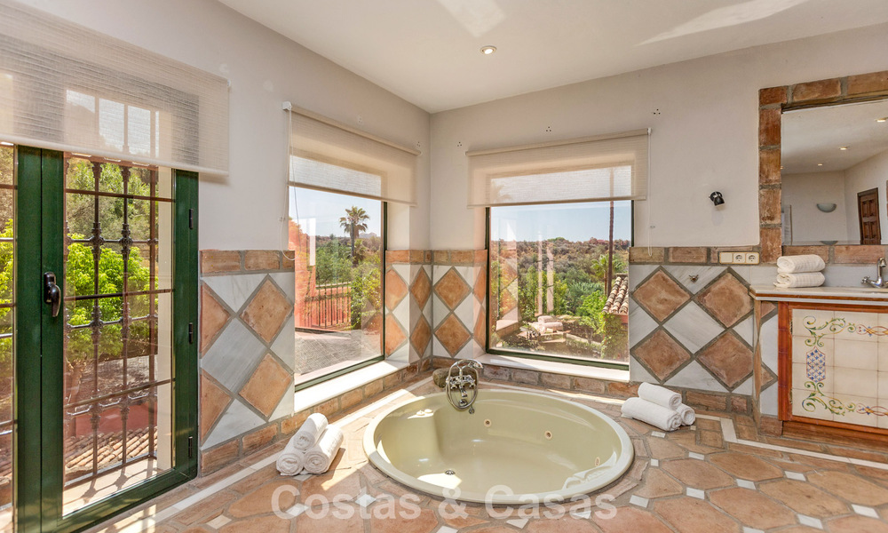 Stately luxury villa for sale in a classic Andalusian style in a gated, prestigious urbanization in Benahavis - Marbella 787997