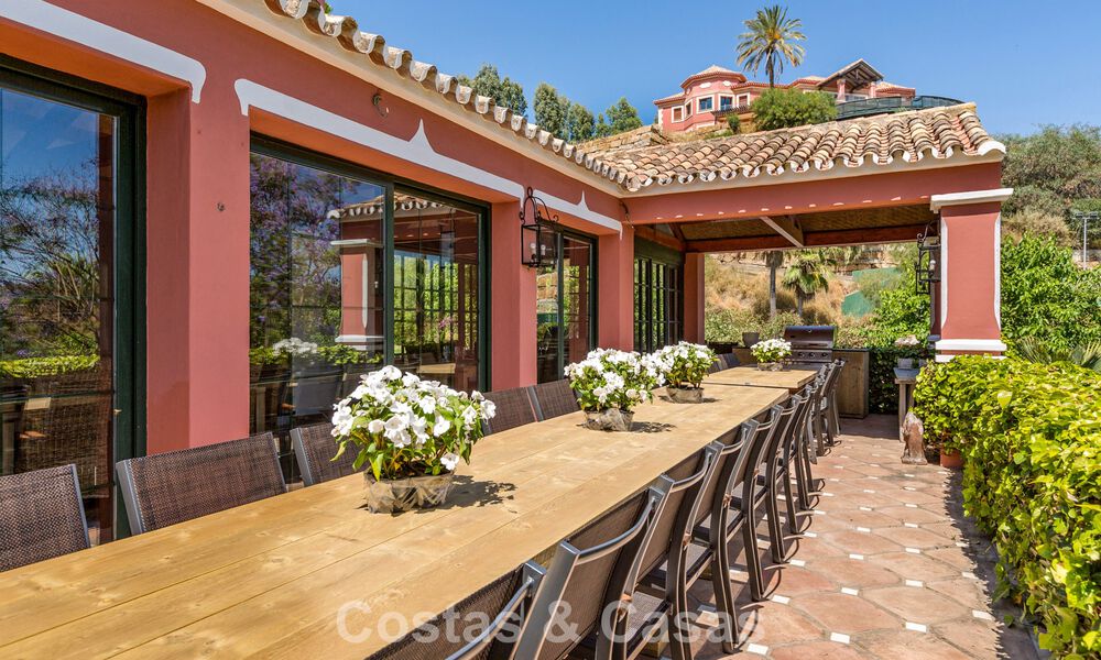 Stately luxury villa for sale in a classic Andalusian style in a gated, prestigious urbanization in Benahavis - Marbella 788010