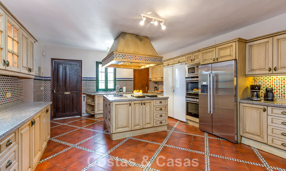 Stately luxury villa for sale in a classic Andalusian style in a gated, prestigious urbanization in Benahavis - Marbella 788013