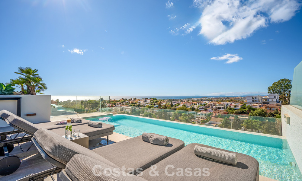 Minimalist luxury home with panoramic sea views for sale in a prestigious gated complex in Nueva Andalucia, Marbella 788609